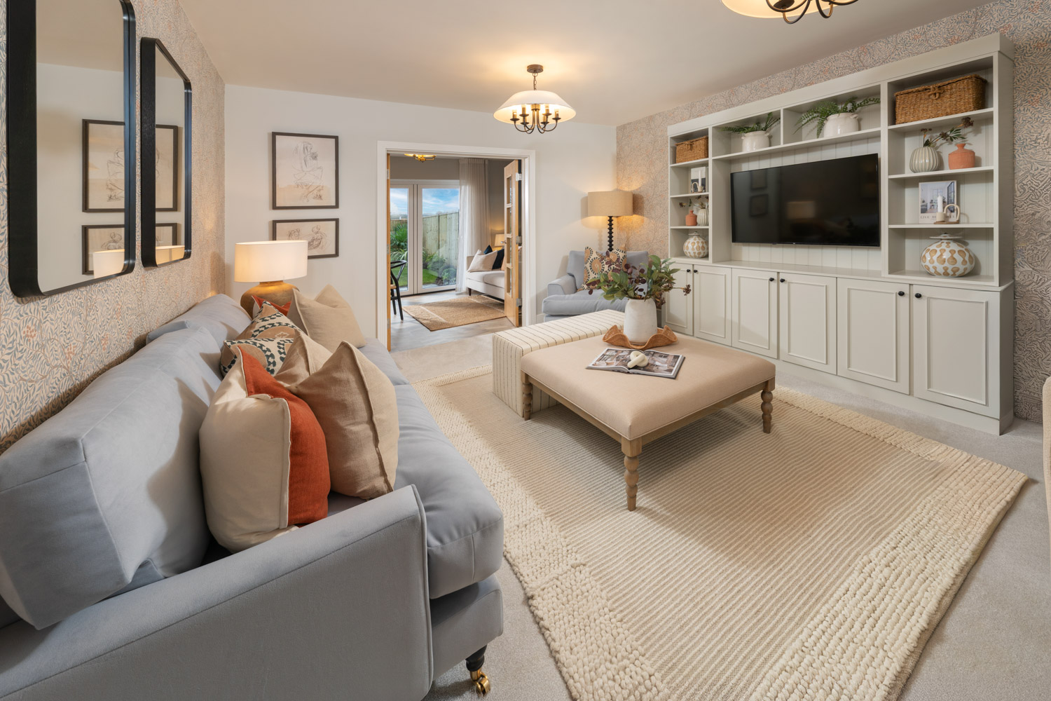 Living room with cream carpet, grey furniture and sofa with cushions